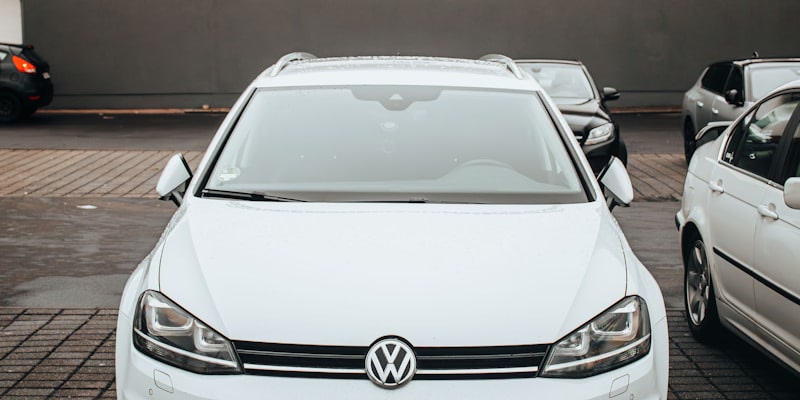 A white Volkswagen Golf seen from the front