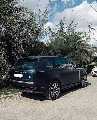 A dark blue Range Rover parked on a driveway